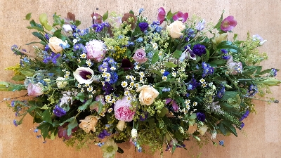 Medium coffin top in garden flowers and mixed foliage