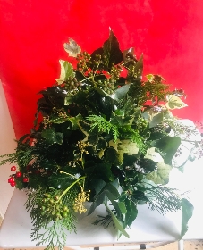 Textured foliage Christmas table posy